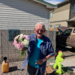 Happy old man with a peony bouquet from Evans Tree Farm and Nursery in Missoula